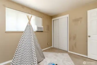 Here is one of the three Bedrooms located on the upper level floor.