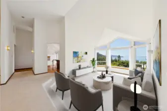 Tall vaulted ceilings create an open main level.  Virtually staged.