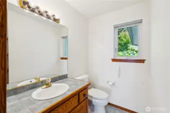 Half bath conveniently located off the kitchen on the main level.