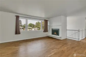 Real hardwood floors and a wood burning fireplace