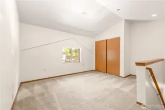 Third bedroom upstairs with vaulted ceilings