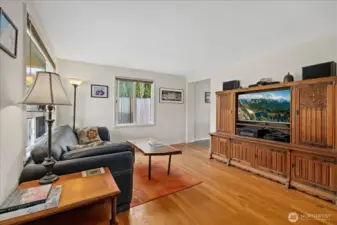 Light-filled living room with hardwood floors