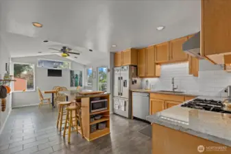 Updated Kitchen with granite counters, island counterspace & seating