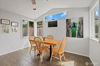 Dining area with vaulted ceiling & abundant natural light