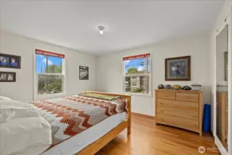 Main-level bedroom with hardwood floors