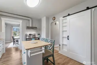 Opposite wall of the kitchen. Here you can see the pantry door plus through to the dining room and hallway