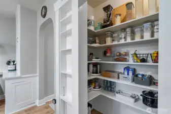 Perfect pantry for Costco runs and everyday kitchen storage. Note the display shelves just outside the pantry.