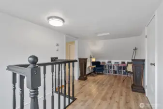 Going upstairs, here is the loft area between two bedrooms. This is the perfect reading room for the sellers! But also ideal for play space, extra hang-out room, or hobby area!