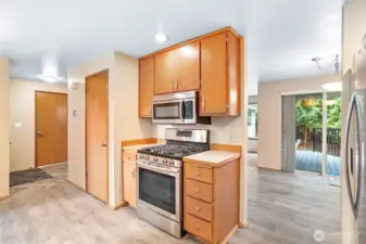 Kitchen looking toward dining room and slider to new Trex deck