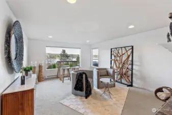 Family room boasts another water view window, giving it an airy feel. There's a mountain view as well!