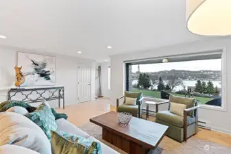 Living room looks out to Hale Passage and the Fox Island bridge.  The large bay window creates a serene and immersive connection with nature!