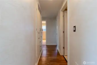 Hall leading to 3 main level bedrooms