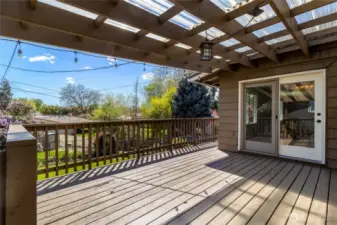 Upper deck with access from Dining area. Stairs to lower yard and pool.