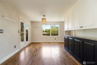 Dining room with built in hutch. Access door to upper deck, a perfect spot to BBQ and entertain friends.