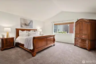 Your luxe primary suite! Vaulted ceiling, great light, and spacious!