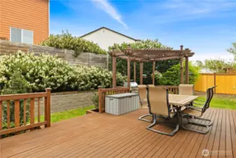 The peaceful backyard has expansive decks, for lower maintenance and ease of use in all seasons!