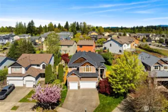 Your lot lines extend to the edge of the grass on the right! Lots of room to relax and play in the front