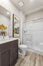 Main floor Bathroom with Shower. Photos are for representational purposes only.  Colors and options may vary.