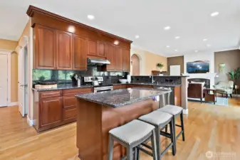 Large center island offers bar seating perfect for casual meals, morning coffee or entertaining guests.