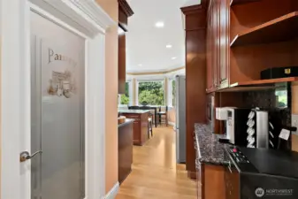 Dedicated coffee bar area adds a custom touch perfect for your morning routine or displaying favorite mugs and essentials.