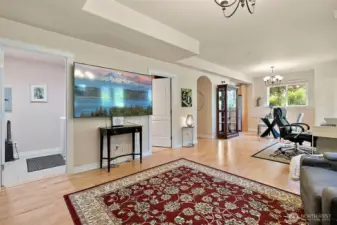 Expansive living and dining area in the fully finished lower level, offering comfortable living with direct access to a large patio area-perfect for indoor outdoor entertaining or relaxing in privacy.