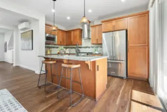 Kitchen with center island with breakfast bar.