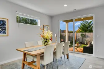 Dining area flows out to patio and large backyard newly landscaped
