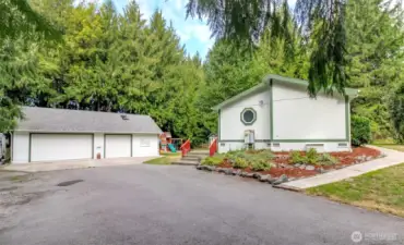 Massive 1300+ sq ft garage and heated shop with tons of parking and storage