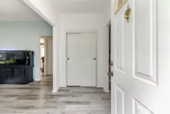 Entry with engendered wood flooring throughout the entire home