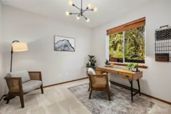 Mainfloor den with serene view. A great place to work from home, craft/study, or extra guest space.