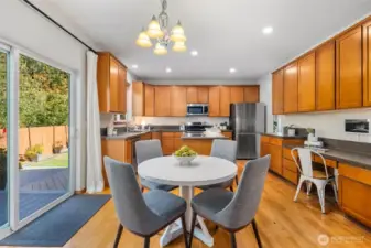 Eating nook with oversized sliding glass door to back deck.