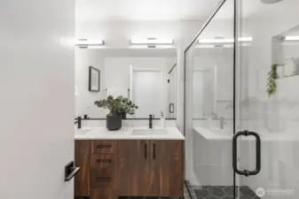 Primary bathroom.  Photo is of model home of same floorplan. Color schemes of finishes may vary.