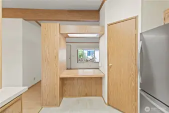 Built in desk in kitchen, walk in pantry to the right.