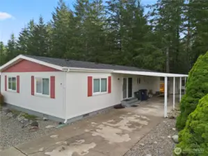 Carport with storage shed at the back.