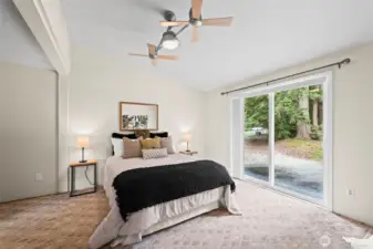 Primary bedroom with slider to back patio.