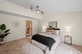 Primary bedroom with ensuite 1/2 bath and walk-in closet.