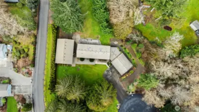 Set on 1.13 acres, a serene, park-like setting with mature trees, natural landscaping, and open level spaces.