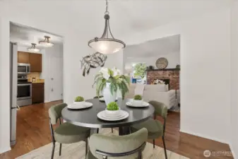 The dining area is perfectly positioned for both casual meals and hosting gatherings. It flows effortlessly from the living room, creating a connected and functional main level.