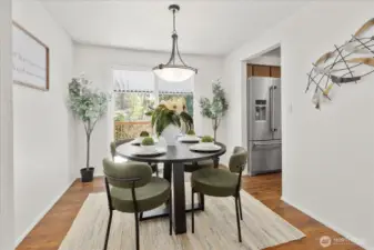 A sliding glass door brings in natural light and provides direct access to the covered deck. This indoor-outdoor connection makes entertaining easy and enjoyable.