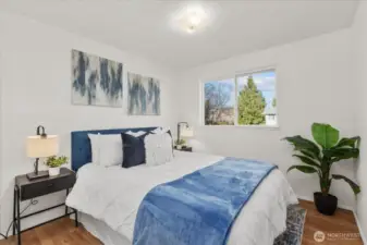 Two additional bedrooms are located upstairs, providing flexibility for a variety of needs. These rooms are ideal for guests, home offices, or household members.