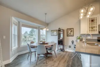 Dining room with eat at kitchen peninsula has seating for all your guests