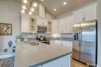 Granite slab countertops add elegance to this inviting kitchen