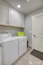 Laundry room/mud room adjacent to garage