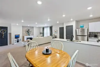 Main-level features living area, dining area, and an open-concept kitchen