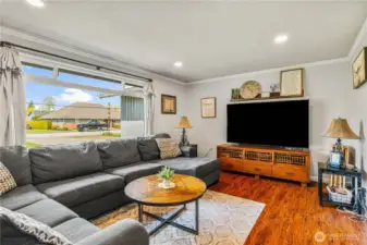 Living room with large window for lots of natural light.