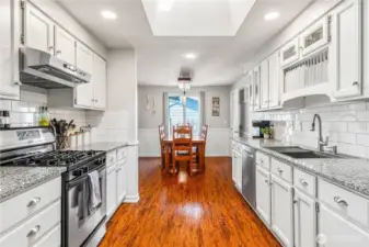 Galley style kitchen with modern finishes and storage.