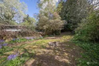 Huge backyard full of potential! Two storage sheds tucked in the very back.