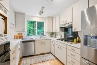Nice sized kitchen with ample counter and cupboard space.