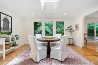 This room is perfect for a dining room, sitting or living room! Lots of light with the large windows and skylight.