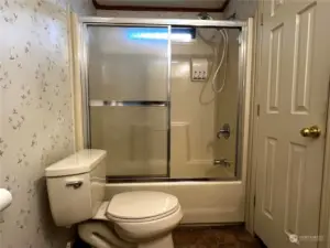 Hall bathroom with rarely used shower/tub